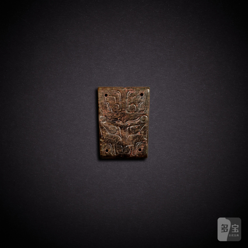 A celadon jade 'mask' plaque, Shang dynasty | 商 青玉獸面紋牌